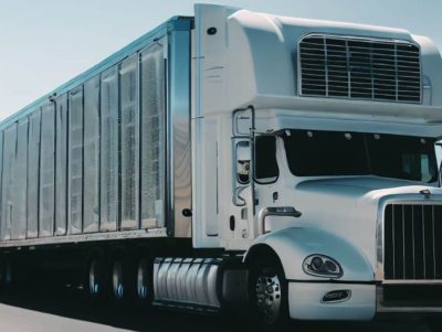 A truck with refrigeration units on the side